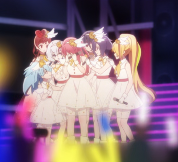 The Main Character Crying after a very emotional and triumphant moment, while the rest of the zombie idol group gives her support